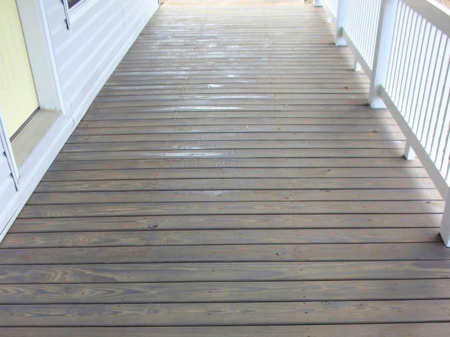 After picture of porch deck that has been pressure cleaned and stained.
